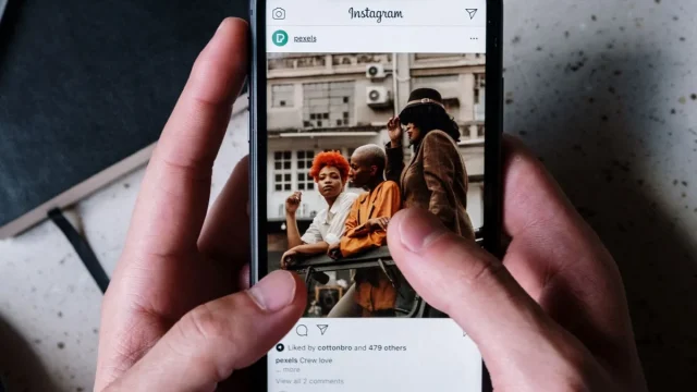 hands-browsing-instagram-on-smartphone.webp